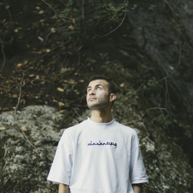 Alex Rivera, Lead Design Curator at Panel Cipher Glade, reviewing corporate floral arrangements